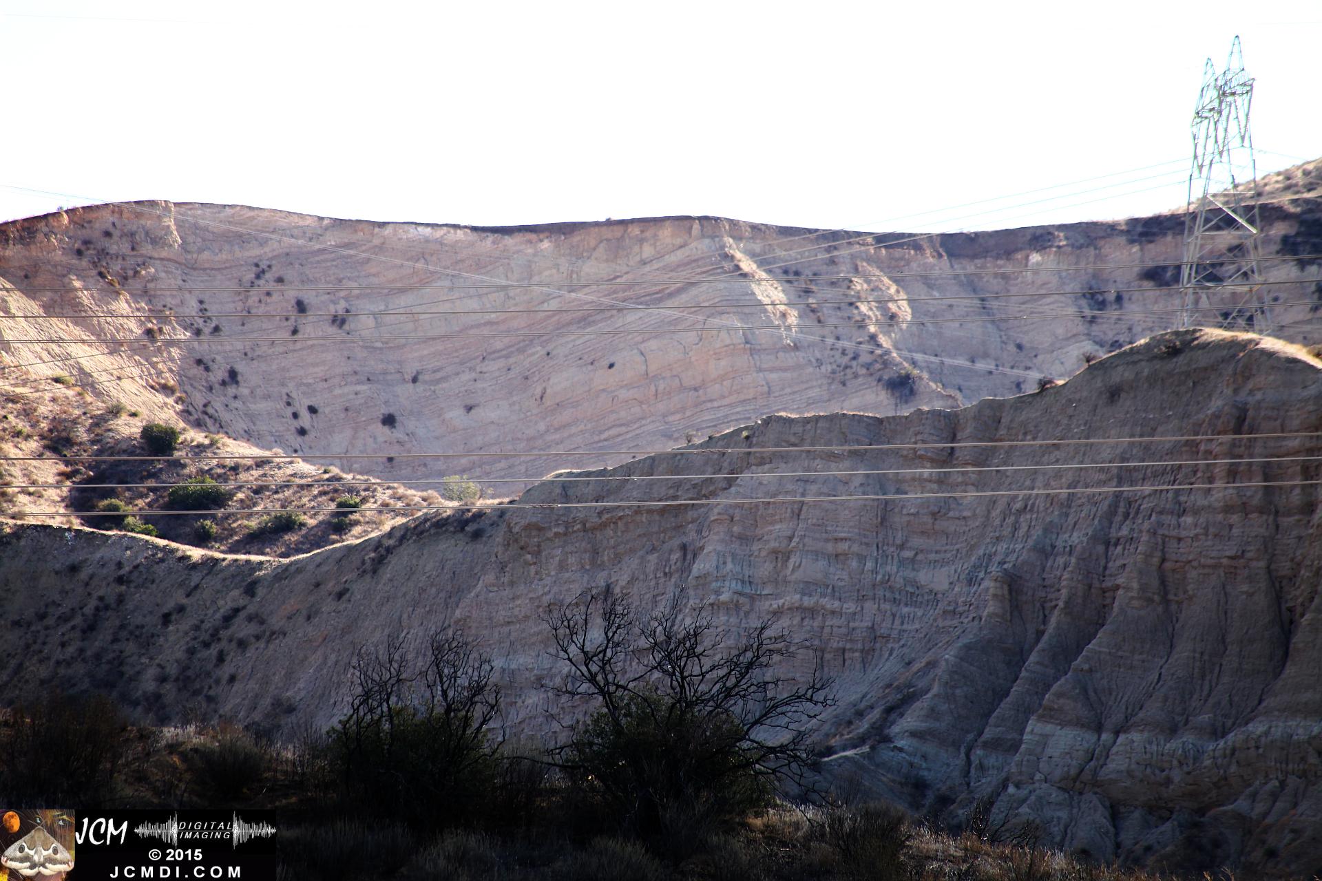 Landslide, buckled pavement, and terrain at Vasquez Canyon Road in Santa Clarita, CA filmed 11-25-2015